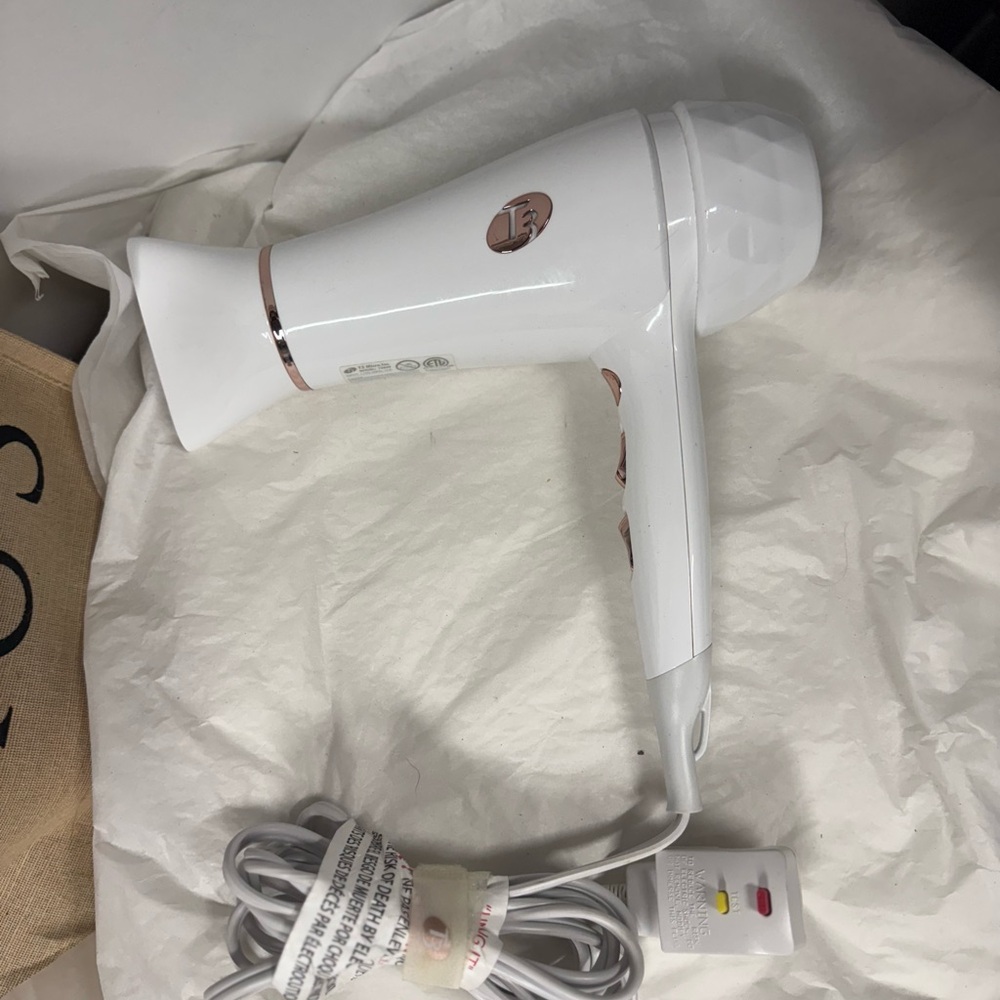 FREE from me!  My small T3 TRAVEL DRYER W/
T3 White and Rose Gold Hair Dryer